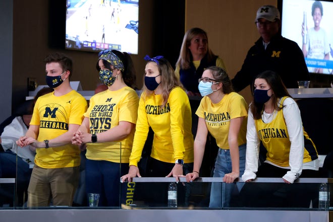 Michigan fans watch as their team takes on Florida State during the Sweet Sixteen round of the 2021 NCAA Tournament on Sunday, March 28, 2021, at Bankers Life Fieldhouse in Indianapolis, Ind.