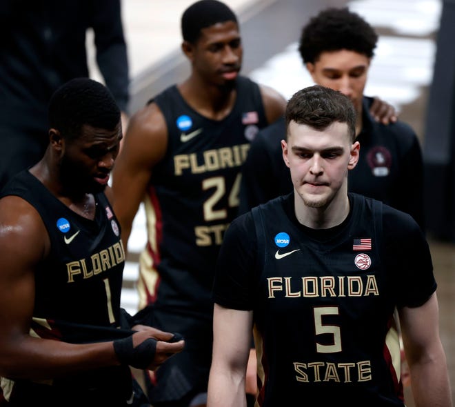 Florida State Seminoles center Balsa Koprivica (5) walks off the court with his teammates after losing to Michigan during the Sweet Sixteen round of the 2021 NCAA Tournament on Sunday, March 28, 2021, at Bankers Life Fieldhouse in Indianapolis, Ind.