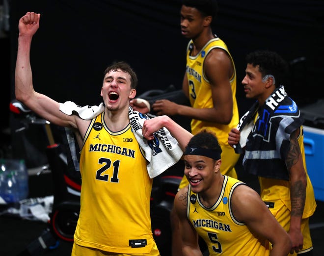 Michigan Wolverines guard Franz Wagner (21) celebrates after defeating Florida State during the Sweet Sixteen round of the 2021 NCAA Tournament on Sunday, March 28, 2021, at Bankers Life Fieldhouse in Indianapolis, Ind.