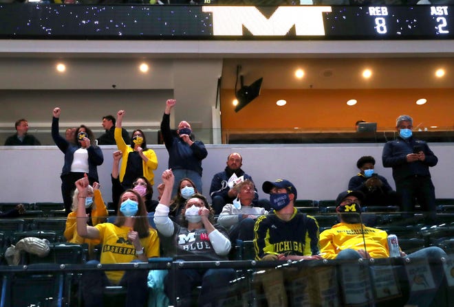 Michigan fans cheer as their team takes on Florida State during the Sweet Sixteen round of the 2021 NCAA Tournament on Sunday, March 28, 2021, at Bankers Life Fieldhouse in Indianapolis, Ind.