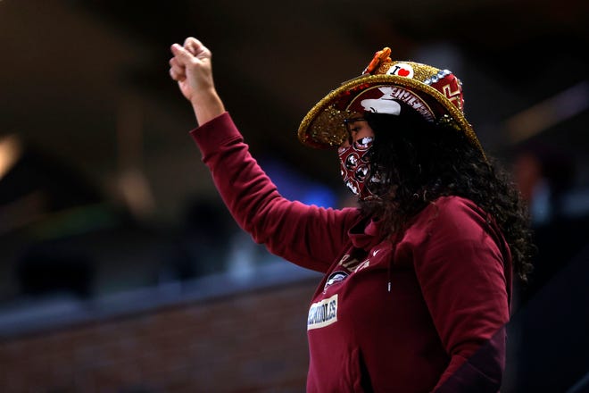 A Florida State fan chants in the stands during the Sweet Sixteen round of the 2021 NCAA Tournament on Sunday, March 28, 2021, at Bankers Life Fieldhouse in Indianapolis, Ind.