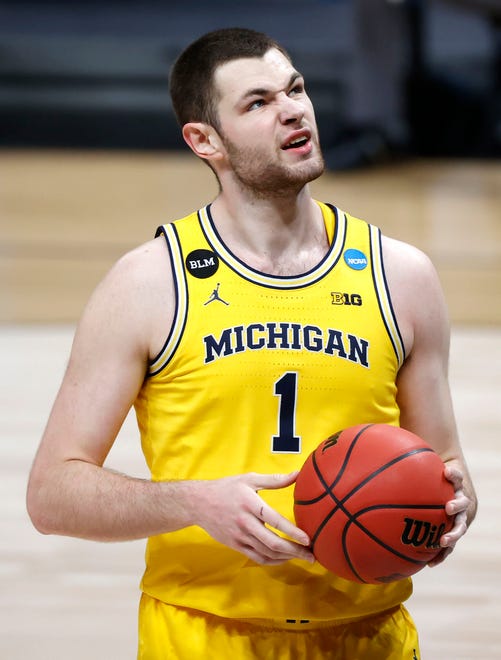 Michigan Wolverines center Hunter Dickinson (1) reacts to being fouled during the Sweet Sixteen round of the 2021 NCAA Tournament on Sunday, March 28, 2021, at Bankers Life Fieldhouse in Indianapolis, Ind.