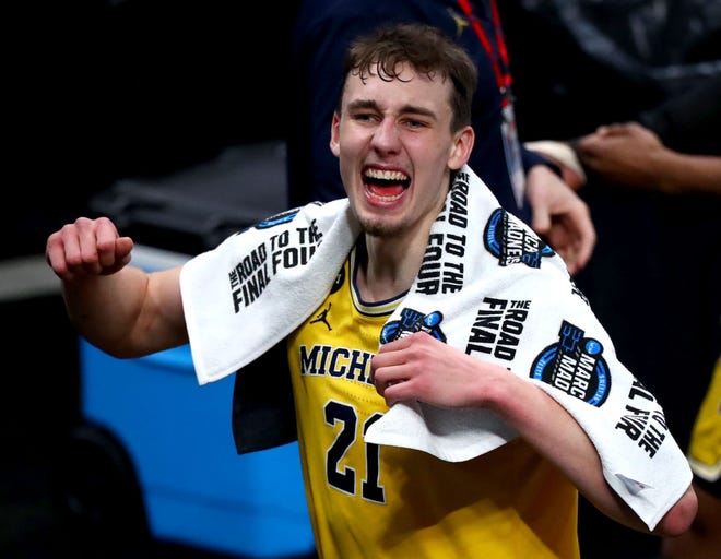 Michigan Wolverines guard Franz Wagner (21) celebrates after defeating Florida State during the Sweet Sixteen round of the 2021 NCAA Tournament on Sunday, March 28, 2021, at Bankers Life Fieldhouse in Indianapolis, Ind.